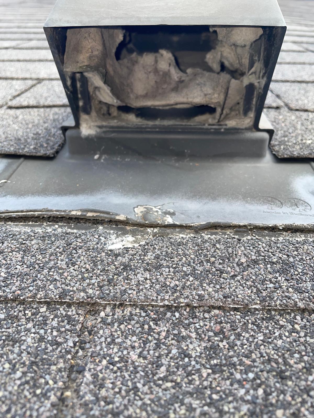 Lint buildup in a rooftop dryer vent before cleaning in Bellaire, TX