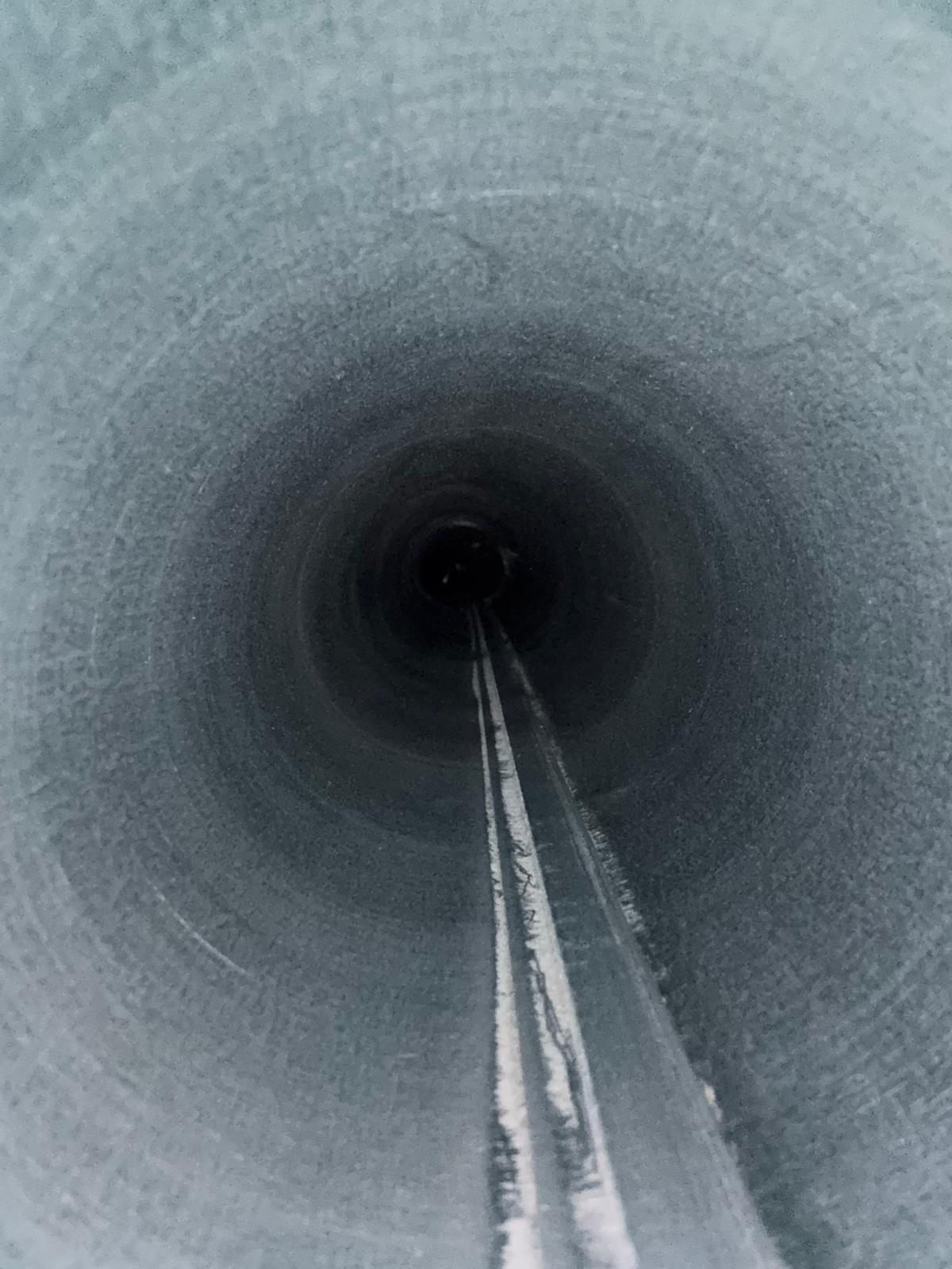 Air duct cleaning in progress with a brush inside a duct in Bellaire, TX